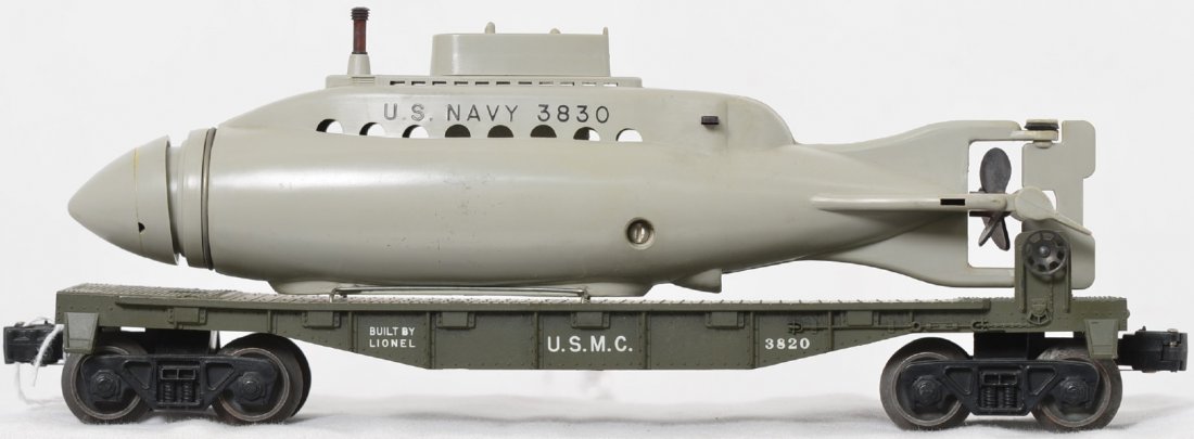 Unrun Lionel Postwar O gauge 3820 USMC operating: Unrun Lionel Postwar O gauge 3820 USMC operating submarine flat car, C8 with a C7 3830 submarine.