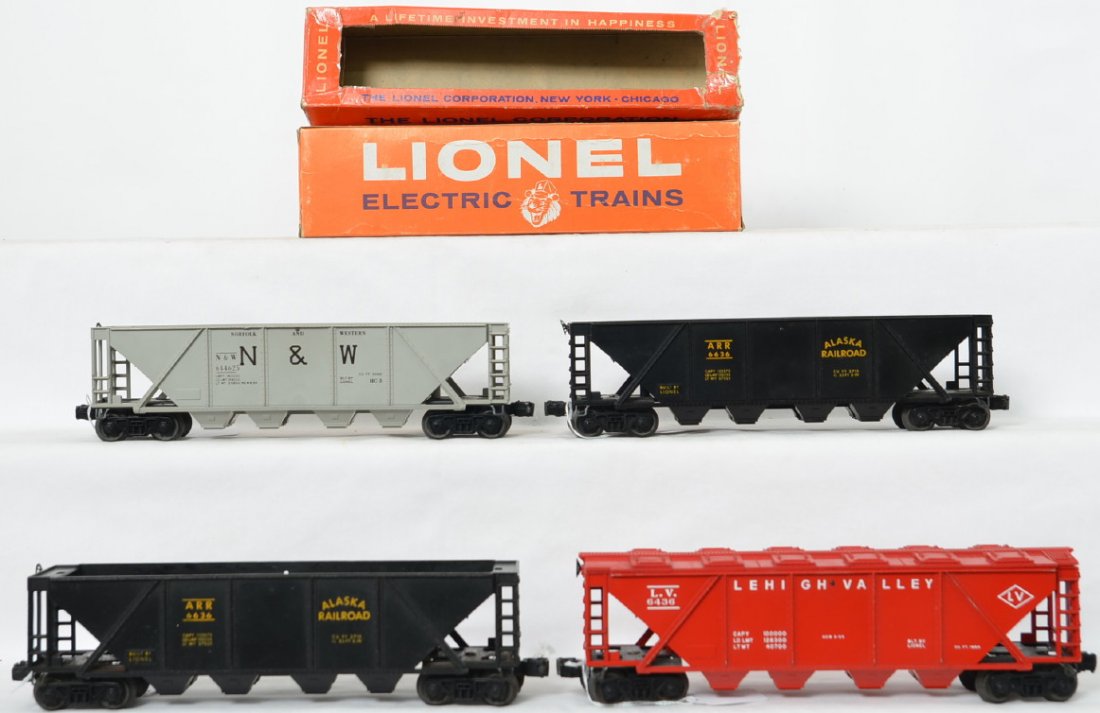 Lionel Postwar O gauge 6446 6436 6636 x 2 hoppers &: Lionel Postwar O gauge 6446 Norfolk and Western with unpainted gray body, 6436 Lehigh Valley covered and two 6636 Alaska Railroad hoppers with two original boxes, one has shelf wear and the other is w