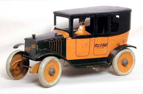Ferdinand Strauss Yell-O-Taxi: Ferdinand Strauss Yell-O-Taxi, app. 8" long, original paint, includes driver and steering wheel that are original. Windup mechanism is all there but seems to not want to release the catch. Paint is