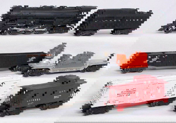 Lionel 665, 6026W, 3472, 3620, 6462 and 6257: Lionel 665 Hudson C6, 6026W tender that is missing one step, 3472 milk car, 3620 searchlight car, 6462 gondola and a 6257 caboose. C6-7. IMPORTANT: Stout Auctions has changed our grading standards to