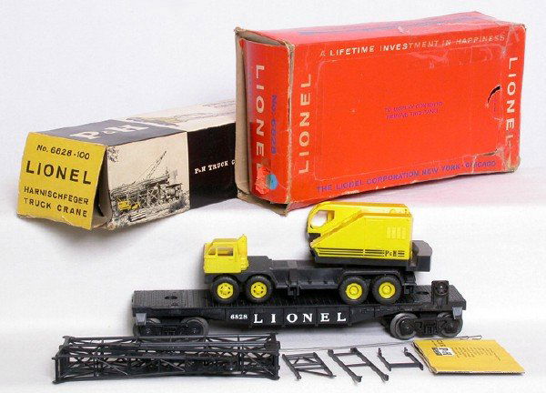 Lionel 6828 flatcar w/ P+H crane, OBs: Lionel 6828 flatcar w/ P+H crane, crane boom base hooks are broken, outrigger feet are missing, original C6+, OBs are worn.
