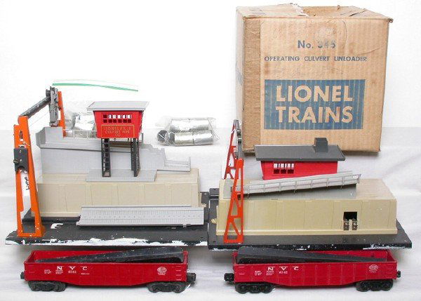 Lionel 342-345 Culvert set OB: Lionel postwar 342 culvert loader and 345 culvert unloader with 6342 NYC gondola metal trucks, 6342 AAR trucks, culverts, 90 buttons and connecting ramp. Both units have white paint along the edge of
