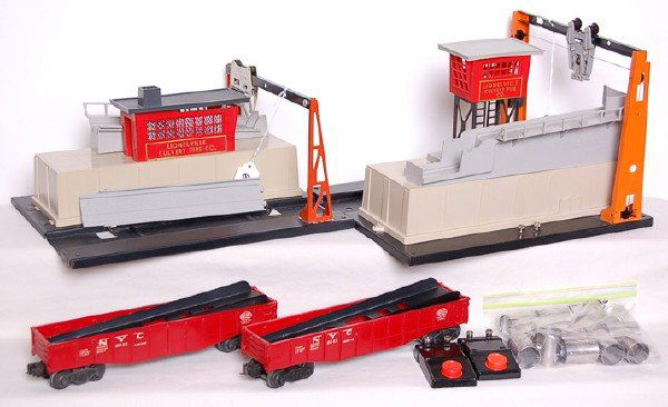 Lionel 342-342 Culvert Set: Lionel postwar 342 culvert loader and 345 culvert unloader with two 6342 NYC gondolas, culverts, 90 buttons, and connecting ramp. Lights were installed and wired in each culvert house. Both units are