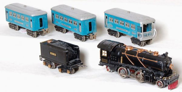 Lionel prewar 262E, tender, 609, 609 and 611: Lionel prewar 262E loco with tender, 609, 609 and 611 blue and silver passenger cars. Tender is restored, rest is original in the C6 area. Missing flags on the loco. Repro wheels on the engine drivers