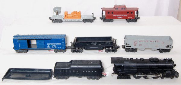 Lionel 646, 2046W, 6520, 6468, 3469, 6456, 6417: Lionel 646 steam engine with 2046W tender, 6520 searchlight car, 3469 coal dump car, 6468 blue Baltimore and Ohio boxcar, 6456 gray hopper and a 6417 NYZ PRR caboose. Set is in the C6 area. Includes a