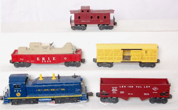 Lionel 624, 6656, 6456, 3444 and a 6017: Lionel 624 Chesapeake and Ohio switcher, 6656 stock car, 6456 hopper car, 3444 Erie animated gondola and a 6017 caboose. C6 area.