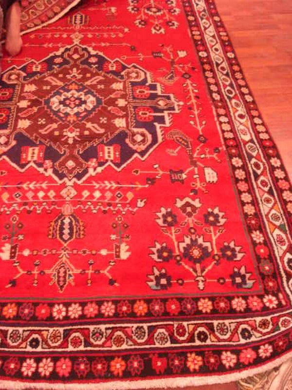 Sirjan Rug: Sirjan Rug, red ground with browns and blues, handwoven in Iran from Ghandi, 8'6" x 5'6"
