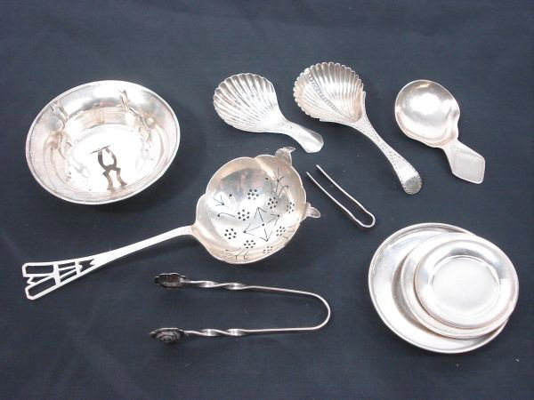 7 Pieces: 4 Early Tea Caddies including William Ba: 7 Pieces: 4 Early Tea Caddies including William Bateman (c1785), Joseph Taylor (c1819), John Blake (c1803), E Viners (c1864); 3 Sterling underplates; Sterling Sugar Tongs, one SP Caddy Holder, 3.4 Toz