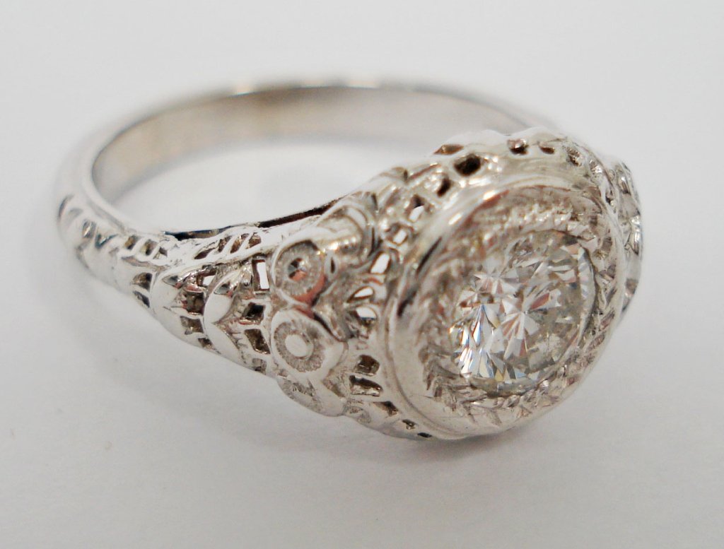 Lady’s Solitaire Filigree Style Diamond Ring: Lady’s Solitaire Filigree Style Diamond Ring, round brilliant cut diamond weighs approx. 0.64 cts., I-1 clarity, G color, set in 14K white gold, 2.2 dwt, ring size 7