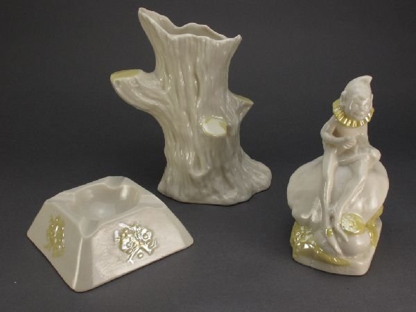 3 Pieces Belleek China: Vase, Leprechan, Ashtray: 3 Pieces Belleek Fine Parian China: "Limpet" Tree Trunk Vase, third (green) mark (1965-81), H.6-3/4"; Irish Leprechan with yellow cobb lustre glaze, third (green) mark, H.5-1/2"; "Thorn" Ashtray, unus