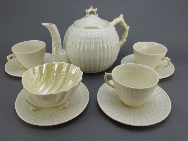 Belleek "Limpet" Teapot, Cups, Saucers: Belleek Fine Parian China: Teapot H.6-1/4", 3 Cups, 4 Saucers in the "Limpet" pattern, seventh (gold) mark (1981-92); also includes a small bowl in the "Neptune" pattern, sixth (green) mark (1965-81),
