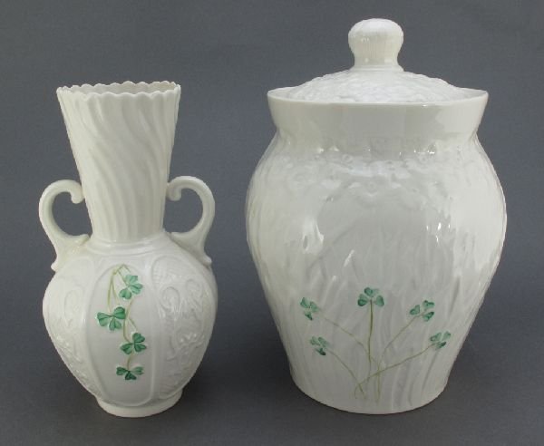 2 Pieces Belleek China Biscuit Jar, Panel Vase: 2 Pieces Belleek Fine Parian China: Biscuit Jar with Shamrock on front, marked "Millenium 2000", H.9-1/2"; "Shamrock" Panel Vase, marked "Belleek in Retrospect 2002", H.8-1/4", both in good condition 