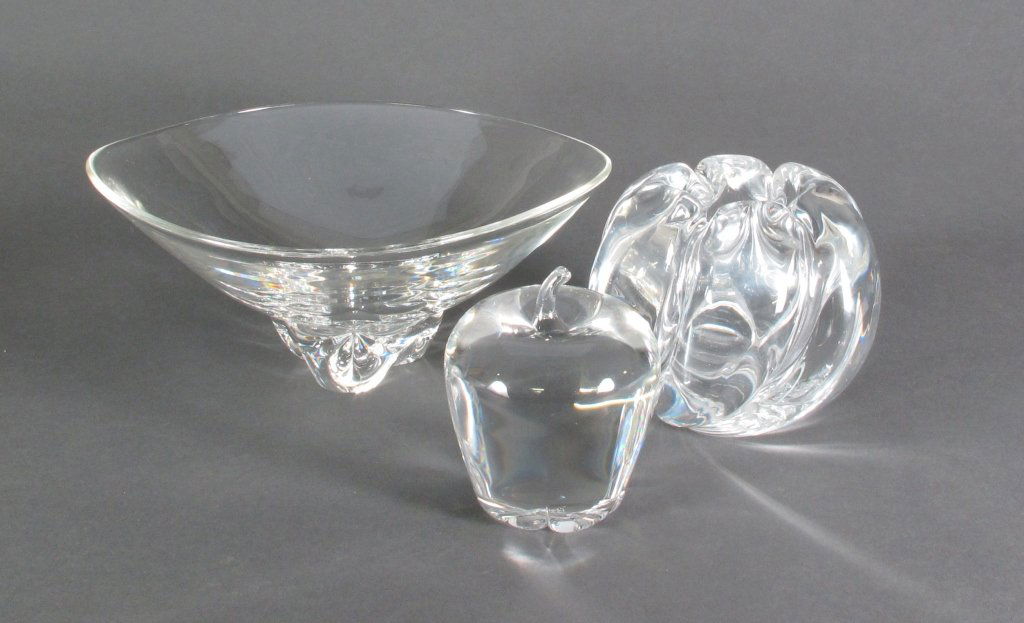 3 Pieces of Art Glass, Steuben, Orrefors: 3 Pieces of Art Glass: Signed Steuben Trillium Bowl designed by Donald Pollard in the 1950's, glass bowl with soft wavy rim and triangular pedestal, Dia. 10", H. 4"; Signed Steuben Apple H. 4"; Orrefo