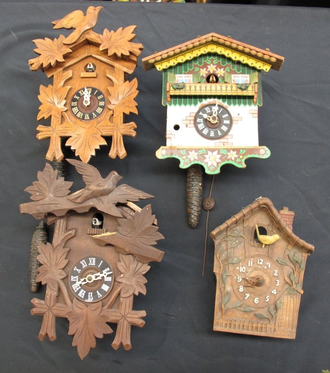 4 German Cuckoo Clocks Not Running: 4 German Single Weight Cuckoo Clocks Not Running: Wooden Cuckoo Clock with bird and leaf motif, broken headpiece, missing pendulum, H. 11"; Wooden Cuckoo Clock with bird and leaf motif, missing pendul