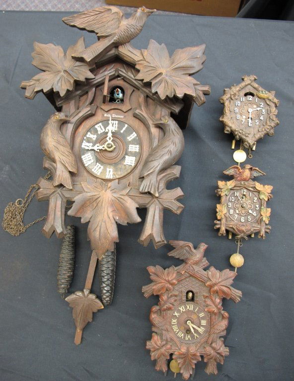 4 Clocks: One Cuckoo, 3 Key Wind, Not Running: 4 Clocks: One Cuckoo, 3 Key Wind, Not Running: German Seth Thomas 2-weight Cuckoo Clock, one chain missing, H. 13-1/2"; Lux USA Cuckoo Style Wall Clock with pendulum, H. 7-1/2"; 2 Cuckoo Style Wall Cl