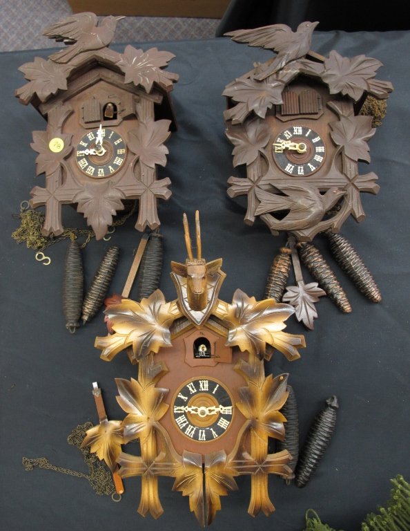 3 German Cuckoo Clocks Not Running: 3 German Cuckoo Clocks Not Running: German 2-weight Cuckoo Clock With Deer Head Motif, H. 14-1/2"; German 3-weight Cuckoo Clock with Bird and Leaf Motif, H. 12"; German 3-weight Cuckoo Clock with Bird