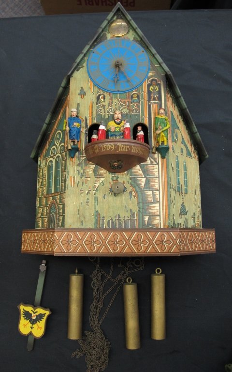 German Musical Wall Clock with Old-Style Music Box: German Musical Clock with Old-Style Music Box, not running, carousel rotates when music plays, "Made in Western Germany" written on back, missing paint, H. 15-1/4"