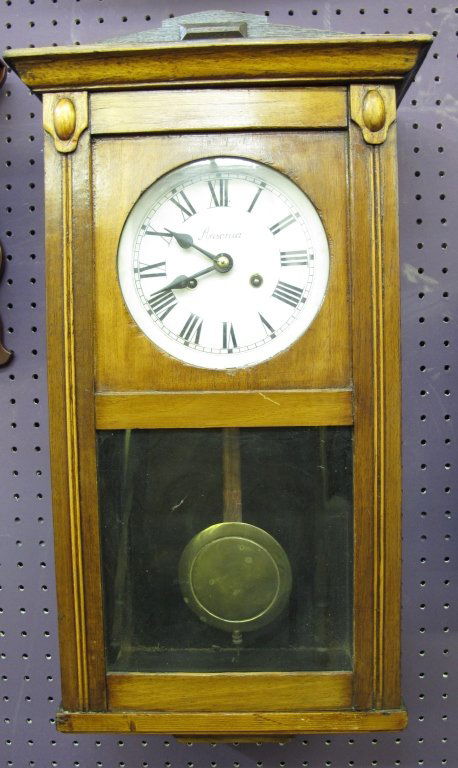 Pendulum Wall Case Clock by Ansonia not running: Pendulum Wall Case Clock by Ansonia not running, but will chime, H. 25-1/4", W. 13-3/4", D. 6-3/8", Dial 7-1/4"