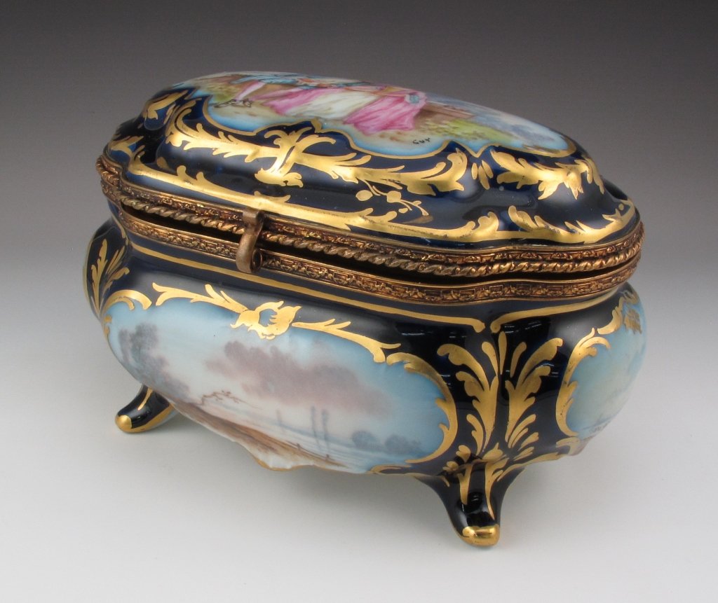 French Porcelain Jewelry Casket by Sevres: French Porcelain Jewelry Casket by Sevres, Handpainted with Ormolu edging around opening, very nice condition with no chips or cracks, H. 4", W.. 6-1/4", D. 4-1/2"