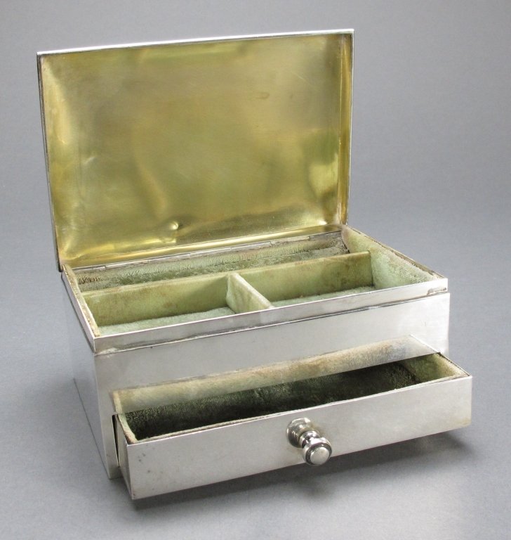 Sterling Silver Jewelry Casket: Sterling Silver Jewelry Casket with hinged cover and small drawer, gold wash on underside of cover, velvet lined, , a few small dents on cover and backside, H. 2-1/2" x W. 5-1/4" x D. 3-5/8", 16 Toz.,