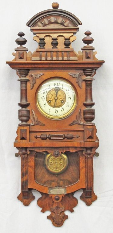 German Wall Clock by Unghans, early 1900's: German Wall Clock by Unghans, slide-down lower pendulum cabinet, hinged clock face cabinet, porcelain face with some stress cracks, beautiful wooden cabinet with excellent finish, wood appears to be s