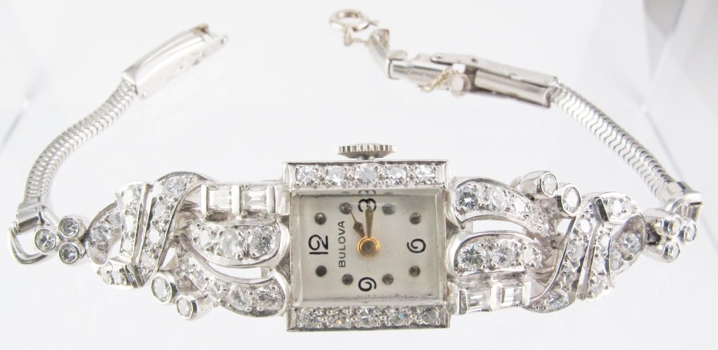 Lady's Platinum Diamond Wrist Watch: Lady's Platinum Diamond Watch by Bulova, total diamond weight approx. 1.60 cts., VS clarity, near colorless, case is platinum, wrist attachments are 14K white gold, original signed Bulova movement, mo