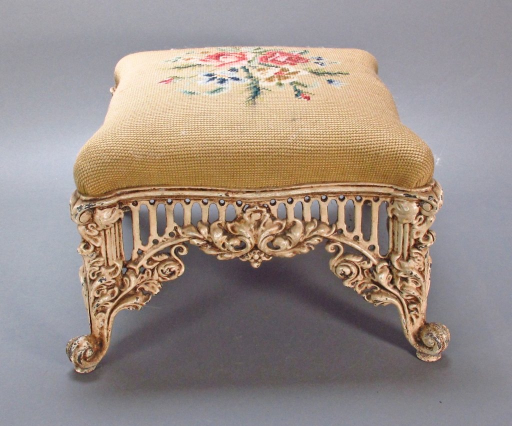 Cast Iron Floral Needlepoint Foot Stool: Cast Iron Floral Needlepoint Foot Stool, cast iron base has columns at corners with scroll and foliate all around, 13" square, H. 9"