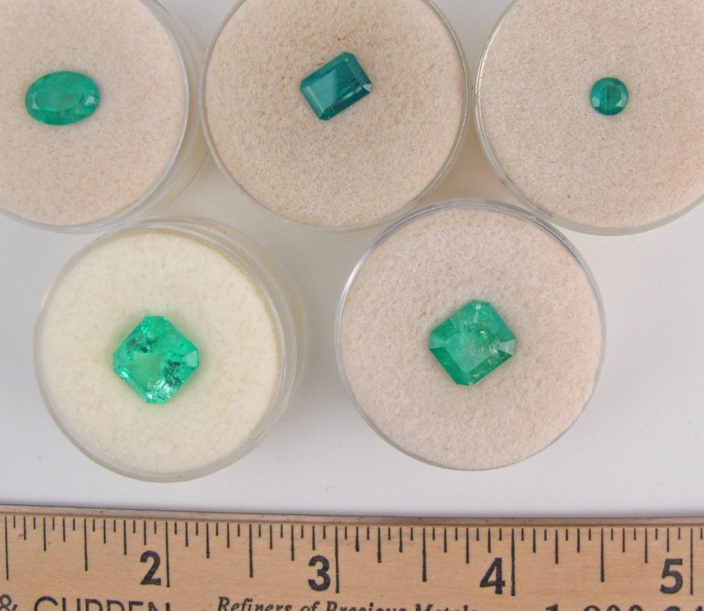 5 Faceted Emeralds 13.32 Cts.: Five Faceted Emeralds totaling 13.32 cts., three marked from Colombia