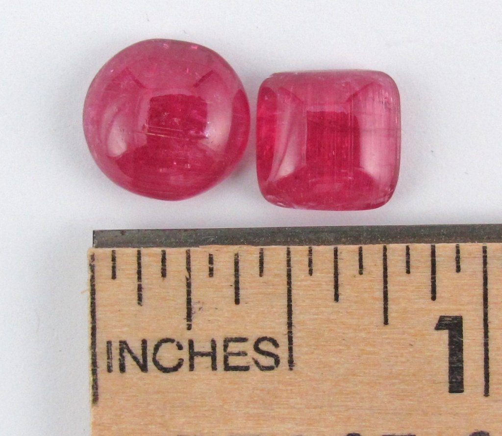 Two Cat's Eye Rubellite Gemstones: Two Cat's Eye Rubellite Gemstones 8.11 Cts., square and round cabochon