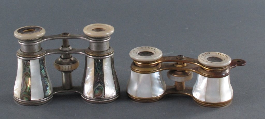 2 Pairs French Mother of Pearl Opera Glasses: 2 Pairs French Mother of Pearl Opera Glasses: La Corona Paris, white MOP, H. 1-3/4", W. 4" (approx), also marked "Whittlesey Optician Cleveland"; Lamier Paris, alternating white and black MOP, H. 2-5/