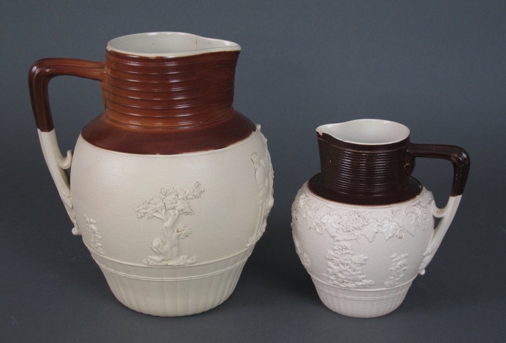 John Turner Ale and Cream Jugs Ca. 1800: John Turner Jugs Ca. 1800s: Cream-colored stoneware Ale Jug with reddish-brown glazed neck, applied ale-drinking man and foliage in relief (some loss), H. 8-1/4", impressed TURNER, hairline (mostly vi