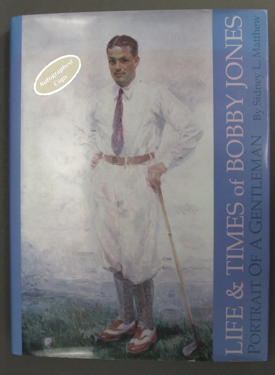 Golf Book: "Life and Times of Bobby Jones" Sidney: "Life and Times of Bobby Jones" Author: Sidney L. Matthew, Published by: Sleeping Bear Press, Chelsea, MI, 1995. Hardcover (with dustjack). Beneath the author's inscription is a gift inscription.