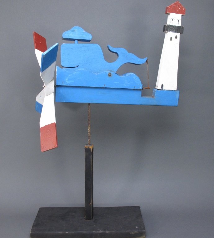 Painted Whale and Lighthouse Whirligig: Painted Whale and Lighthouse Whirligig / Whirlygig, smiling whale bobs along the waves, painted wood, H. 26-1/2"