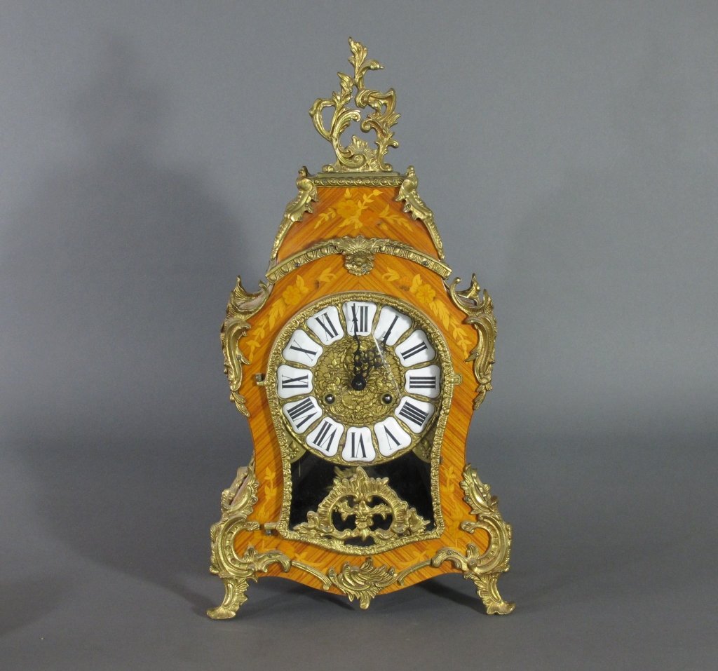 French Style Ormolu Mounted Clock Marked FHS Germa: French Style Ormolu Mounted Clock Marked FHS Germany, sunburst pendulum, "FHS Germany" marked on movement with "151-070", Fruitwood case with floral design and ormolu mountings, Circular brass dial wi