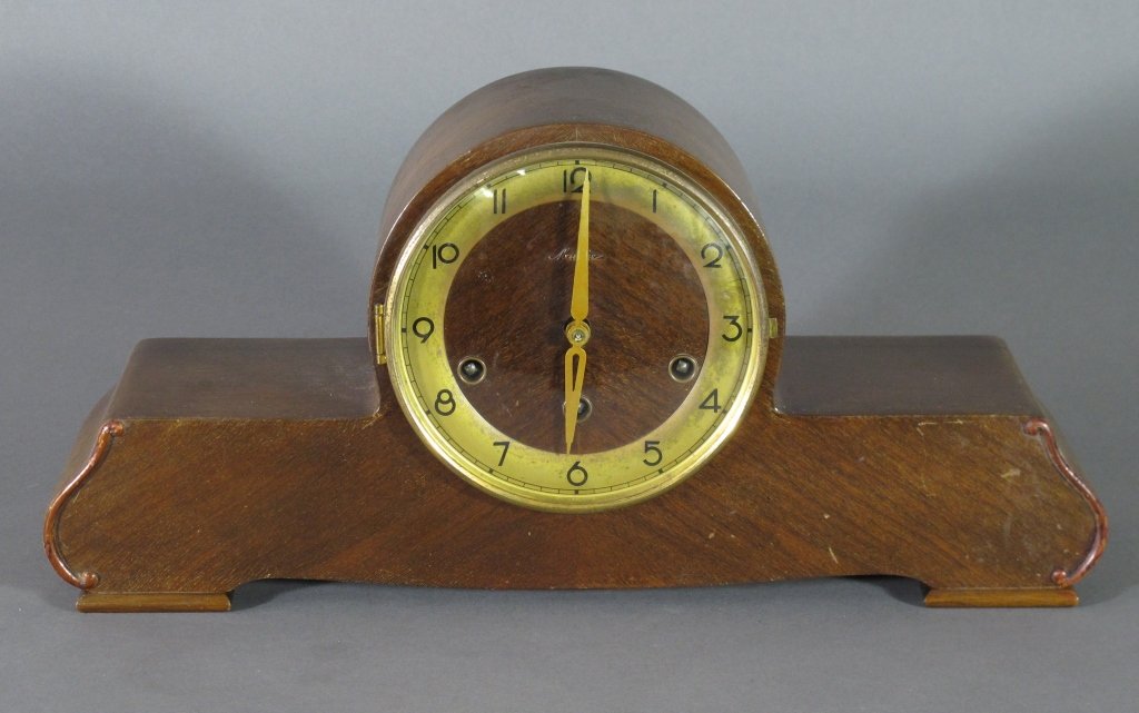 German Mantle Clock Mauthe: German Mantle Clock Mauthe, running, striking on full and quarter hour, cannot guarantee continued running conditon or accuracy, H. 8-1/4", W. 17-1/2", incl key