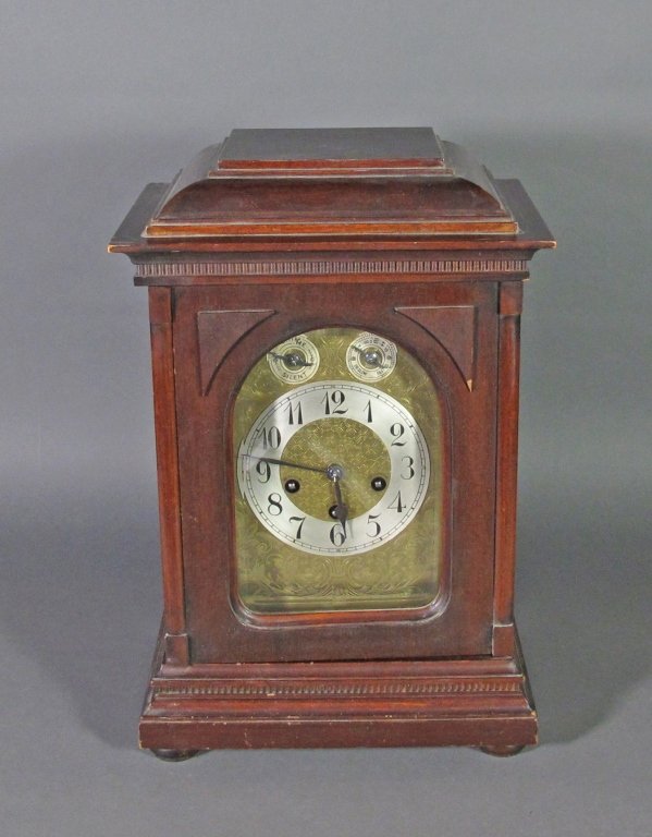 German Chiming Mantel Clock Unghans: German Chiming Mantel Clock Unghans, wooden form , brass face plate, quarter strike, marked Junghans J A10 Germany, H. 17", W. 11-1/2", D 81-4", incl. brass key, running, striking on quarter and full 