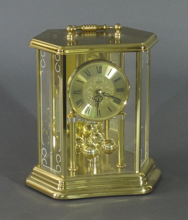 Bulova Brass Clock: Bulova Brass Clock, rotating ball pendulum w/ glass sides, H. 10", W. 7", D. 5"