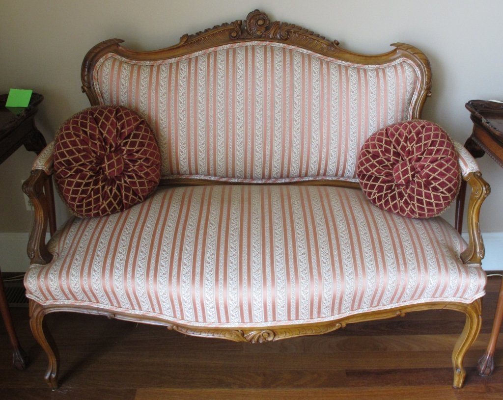 French Settee: French Settee- Striped Fabric with 2 coordinating pillows. Carved crest. L.48"