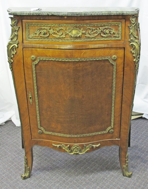 19th C. French Ormolu Marble Top Cabinet: 19th C. French Ormolu Marble Top Cabinet, full drawer over single door, serpentine front, Bombay sides, ormolu mountings, marble top needs repair, single door on front has lock with key, unable to ope