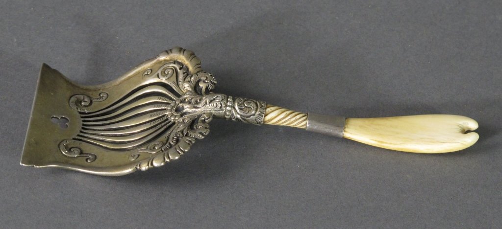 Sterling Pierced Bon Bon Shovel with bone handle: Antique Sterling Pierced Bon Bon / Nut Shovel with bone handle, elaborate lyre shaped shovel with ornate design, L. 5-5/8", hallmark worn, pattern 2888