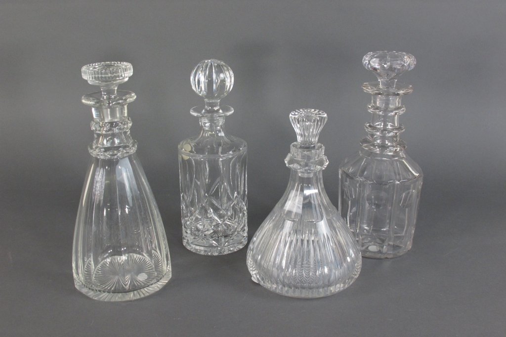 4 - Crystal Decanters: 4 - Crystal Decanters, 1- BLOCK, lead crystal decanter, (chip on bottom edge) H. 10", 3- various styles, height range from 10-1/2" to 8-1/2"