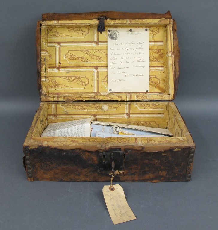 Antique Trunk with Ephemera: Antique Trunk with Ephemera, small leather covered trunk (leather is cracked with some loss), lock with key, paper lined, Ephemera includes letters dated 1941 Augsburg, Mortgages 1849 in the Commonwea