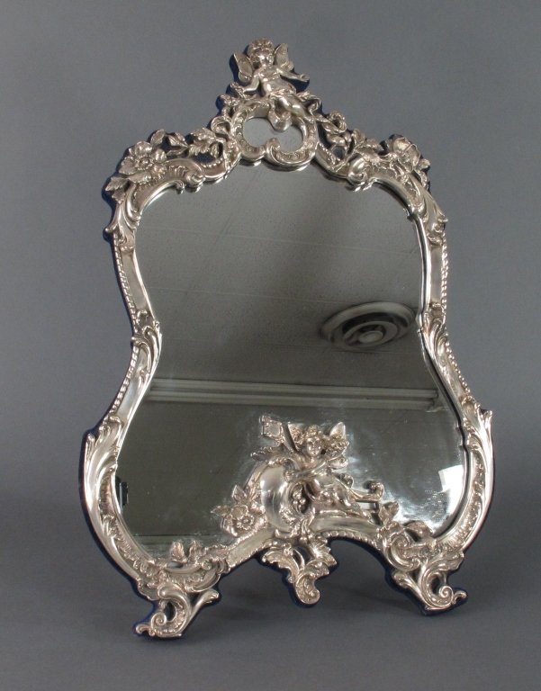 Sterling Silver Art Nouveau Dresser Mirror: Sterling Silver Art Nouveau Dresser Mirror, Cherub and floral motif, hallmarks (see pictures), felt frame and hinged stand, good condition, H. 21-1/4", W. 14-1/4"