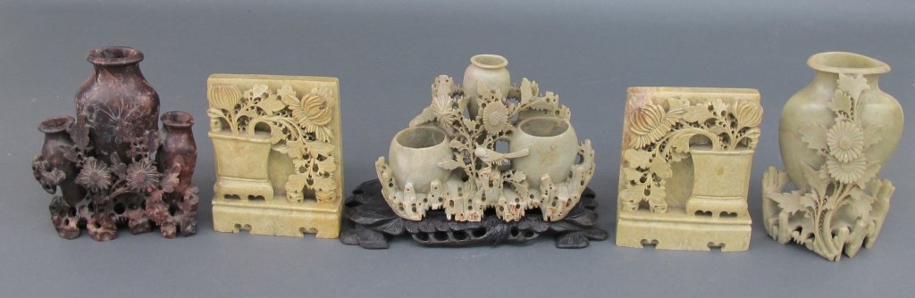 Lot of Asian Soapstone Carvings: Lot of Asian Soapstone Carvings, 3 Floral with vases carvings, 2 are light green (one on base), H. 7" and 6-3/4"; one pair of light yellow bookends (small chip on edge). H. 5-1/2"