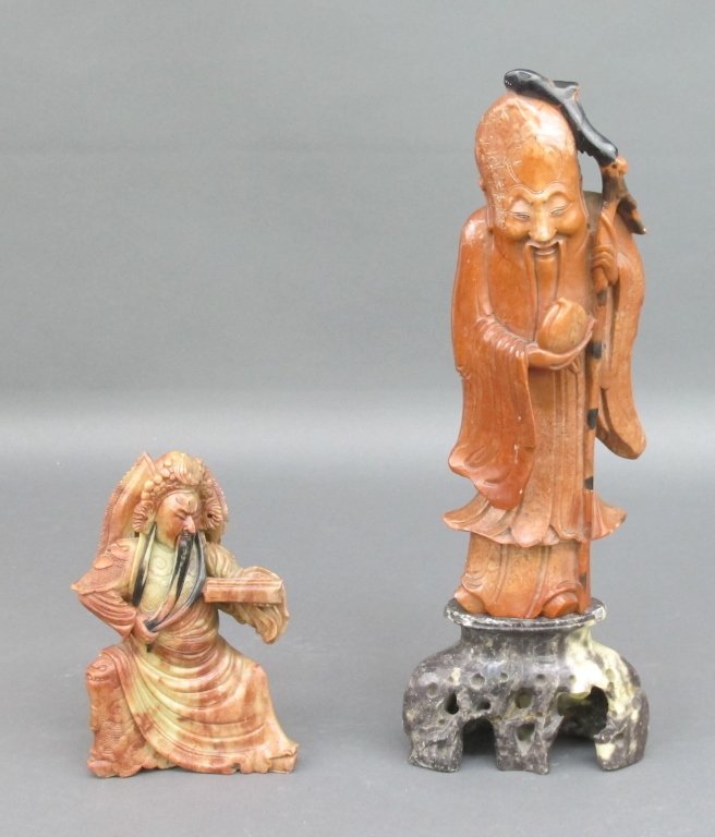 2 Figural Soapstone Carvings: 2 Figural Soapstone Carvings: One man with staff and jug on soapstone base, H. 16"; one warrior, H. 7-1/4"