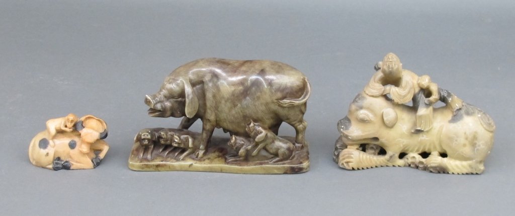 3 Animal Carvings: 3 Animal Carvings: 1 Griffin with 2 riders on back, soapstone, L. 7" ; One yak with monkey on back, soapstone, H. 2", L. 3-3/4" ; 1 Stone pig with piglets (chip on base in back, small chip on snout), 