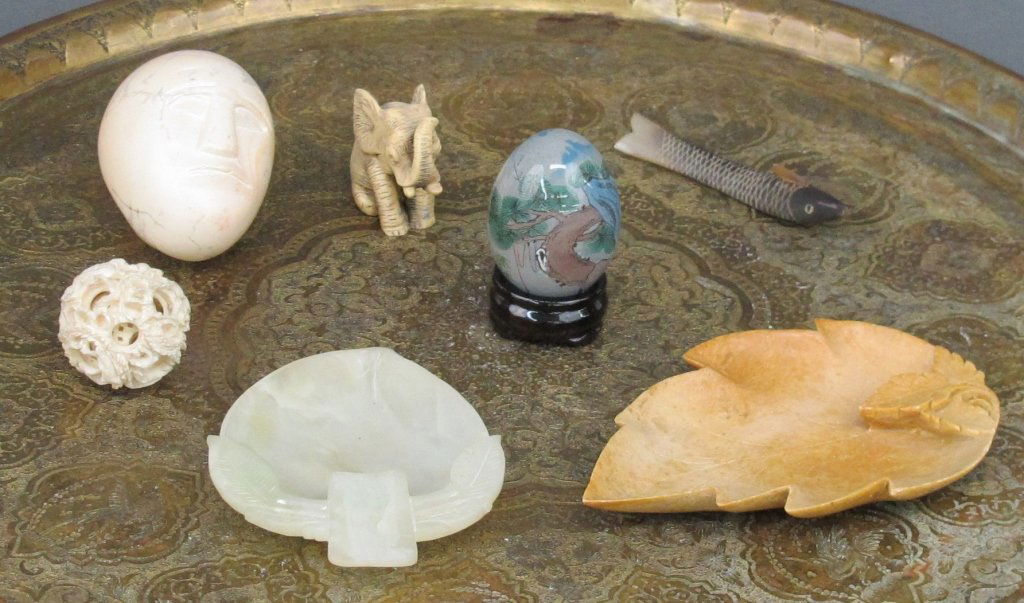 Assorted Asian, carvings, glass: Assorted Asian: Carved alabaster leaf dish, L. 4-1/2" ; Carved soapstone leaf dish, L. 5-1/4" ; Carved fish (horn?), L. 3-1/2" ; Carved stone egg with 2 faces, L. 3" ; reverse hand painted glass egg w