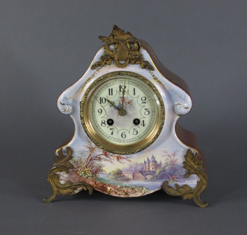 French Porcelain Mantel Clock: French Porcelain Mantel Clock, footed, made in France, 1029 engraved on bottom edge, decorated with gold gilt, ormolu, hand painted, movement marked 1587, clock kicks, does not stay running, no key