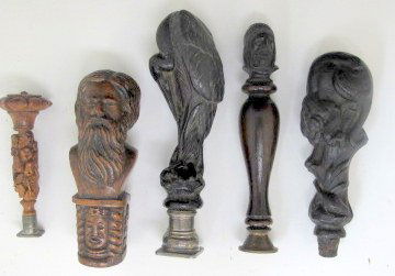 Group of 5 carved black forest wood desk seals (1 of 9)