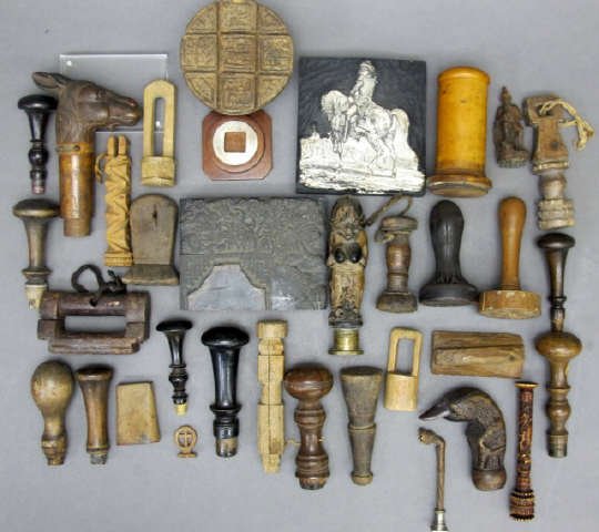 Group of 34 carved wooden desk seals, parasol/cane (1 of 2)